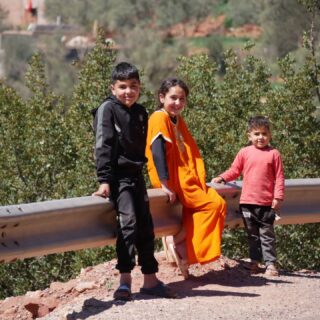 Moroccan kids seem to have a period in their lives where it's compulsory to be as annoying as possible. Shouting, running into the road, trying to grab passing bikes and occasionally throwing stones are universally accepted behaviour. One cheeky little tike even offered to push Zoe's bike only to steal her favourite merino socks from a pannier in the process. Then at a certain age, and we're not sure when or how, they become some of the nicest human beings you're likely to encounter. Perhaps it's the last module they teach before the end of school. 

Refreshed from Fez, the road winds out of the city and inevitably ramps back up towards the sky. Sometimes smooth, sometimes bumpy our route takes us further and further north. The hills are now lush and green with acres of olive groves that offer somewhere to camp and some of the tastiest olives so far. 

We work our way round a huge reservoir and are now feeling the heat from being at a lower altitude. Bottles get filled and drained on the hour every hour.

There are some chunky mountains surrounding us but this is much more densely populated than the Atlas with villages and towns on ridges and plateaus all along the road. People are busy everywhere which means more interaction with kids but also some more kind hospitality.

After another unexpected but much needed night with a family the group splits three ways. Benni has a fever so chooses to spend the day resting. Zoe and Kirsty have a stretch of road down to Chefchouen while Tara and I are keen for a challenge. 

Sometimes you have to be careful what you wish for. The 44km route through Tallasamtane National Park proves to be one of the toughest days either of us have been stupid enough to spend on a touring bike. We eventually drop down into Chefchouen just before sunset battered, bruised and hungry but somehow still happy that we'd gone that way.

There are just a few days left now until we reach The Med. Time to ease off the gas and wring as much out of that time as we can. We won't miss the kids though.