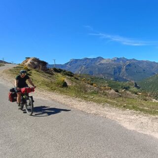Pop quiz: Does Spain have a land border with Morocco?
Answer below....

It's the last few days of the Moroccan leg of the trip and we mix with the tourists in Chefchouen before climbing through the now obligatory route through the town's tip. It must have been a joke by the Bikepacking.com route designer to include a tour of all the tips in the country along the way. Benni rejoins us and we enjoy smooth roads for an easy morning's ride.  We could have been even more chilled out if I'd accepted one of at least a dozen offers of hash along the way. Copious amounts of marijuana are grown on these hillsides and it seems that everyone is a dealer.
Another spectacular gorge opens up before us in the evening light and we settle into a campsite right by the river.
The same gorge then offers Tara and I our final off road section as we pick our way along a thin ribbon of donkey track perched on a ledge part way up the cliff. The view is magnificent but most of our attention is focussed on staying upright.
Back on the road, the deep blue of the Mediterranean appears on the horizon and becomes our companion for the last 2 days. Through Tatouan we find ourselves in what feels like a completely different country. Expensive coffee shops sit next to huge gated communities, golf courses and BMW dealerships. This is where the wealth of Morocco comes to retire and it's a world away from the mountain villages from just a few days ago.
Then we reach the border. Police patrol the road leading up to it and there's a tall fence topped with barbed wire. We get waved up to the first booth and asked what is in our panniers. There's not much investigation after peeling back the first layer of dubious smelling kit so we get stamped out and say Hola to Spain. This is Ceuta, a small enclave that has belonged to Spain since 1578. 
We spend our last night in Africa high up on the peninsula with views over the straight of Gibraltar including the rock itself. Mainland Spain feels within touching distance and will be our destination in the morning. There's still some planning to be done as to how we will be getting home but it will probably involve some buses, trains, cycling and a ferry.