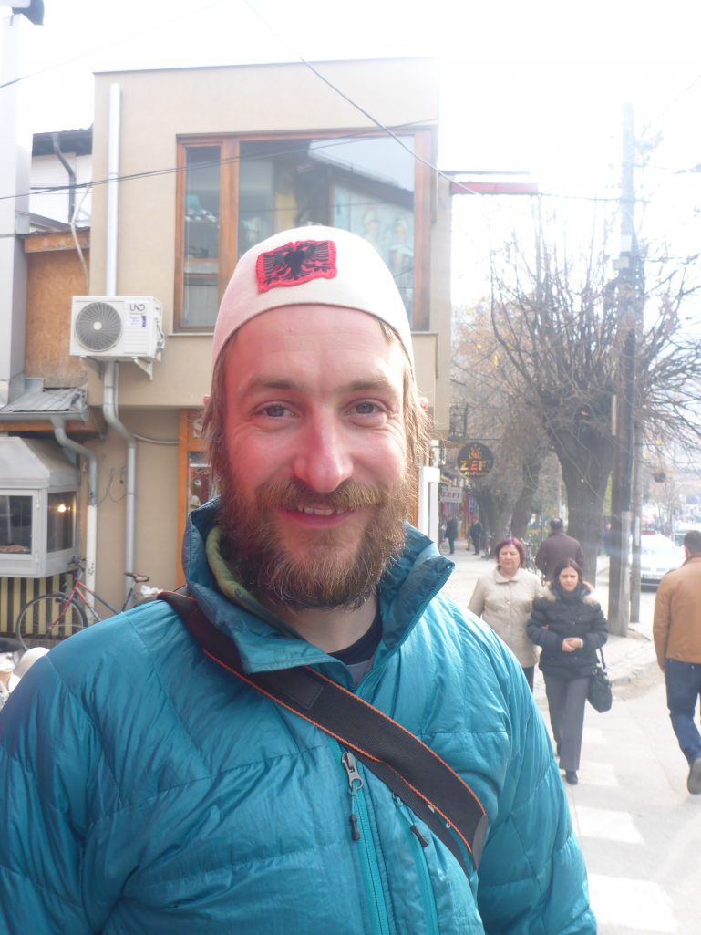 Trying an Albanian hat for size